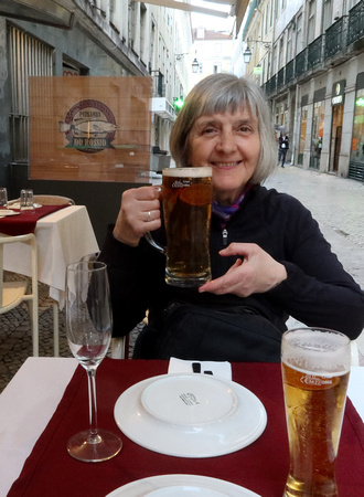 Mary Ellyn having a beer in Lisbon
