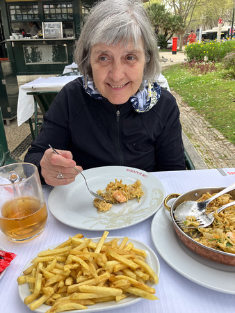 Mary Ellyn eating fish at her favorite restaurant in Portugal