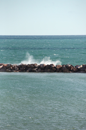 PAd July 1 Waves crashing against breaker