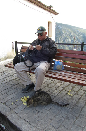 Dave feeding a cat in the town of Delphi